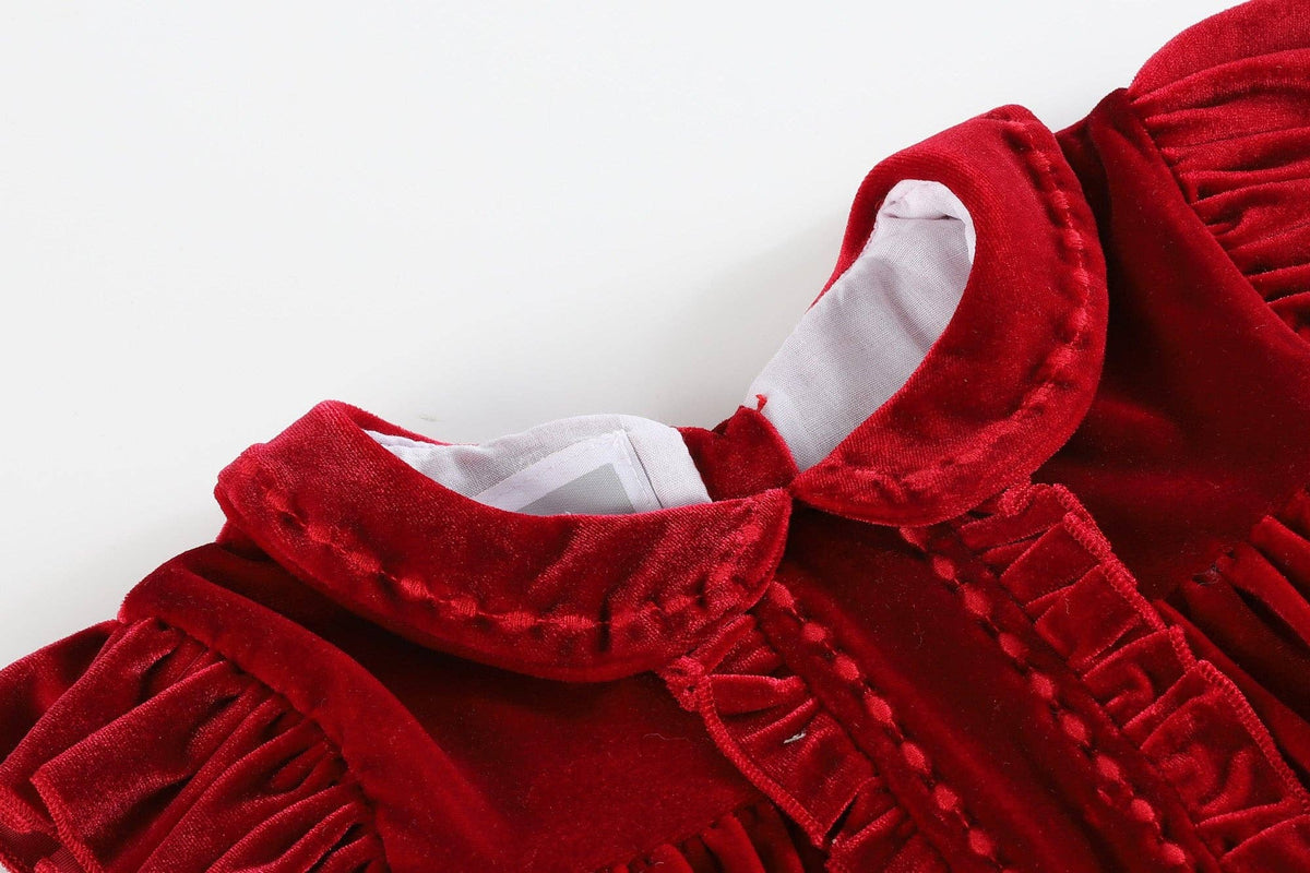Red velvet dress with ruffled collar on a white background