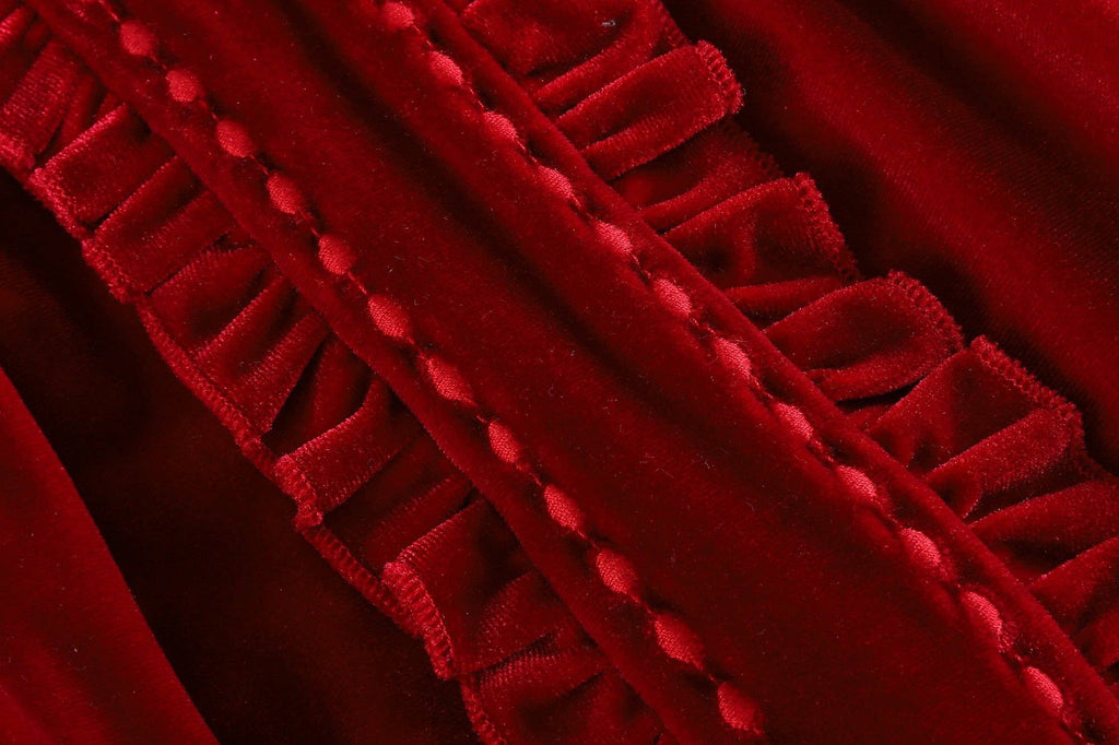 Close-up of red velvet fabric with a textured edge