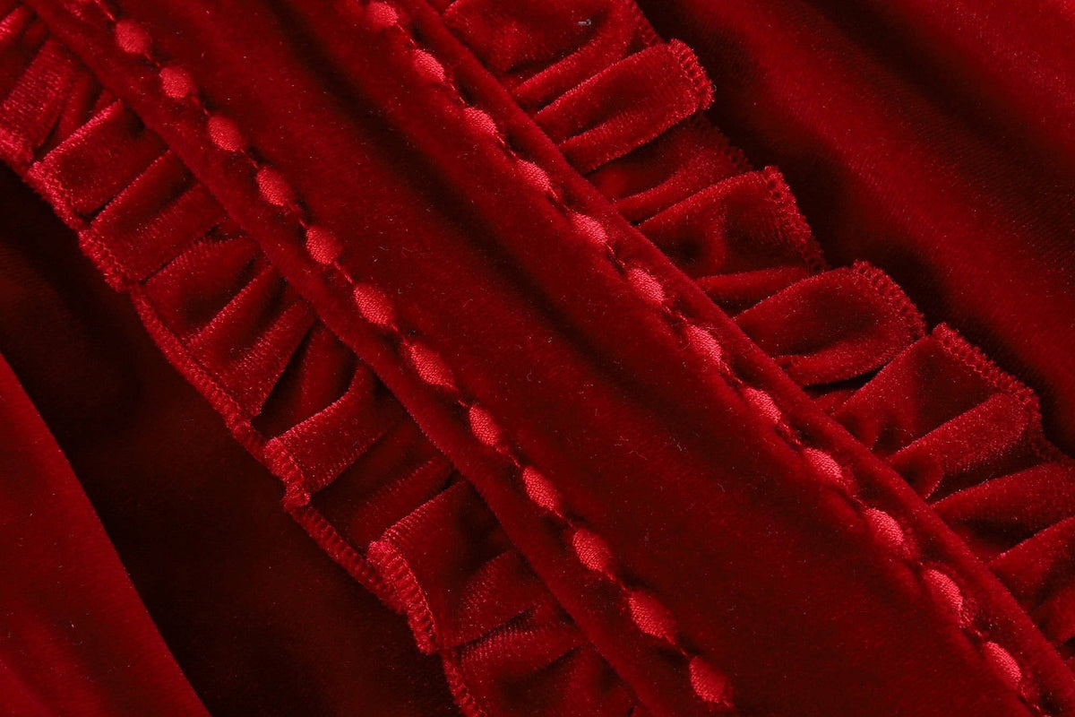 Close-up of red velvet fabric with a textured edge