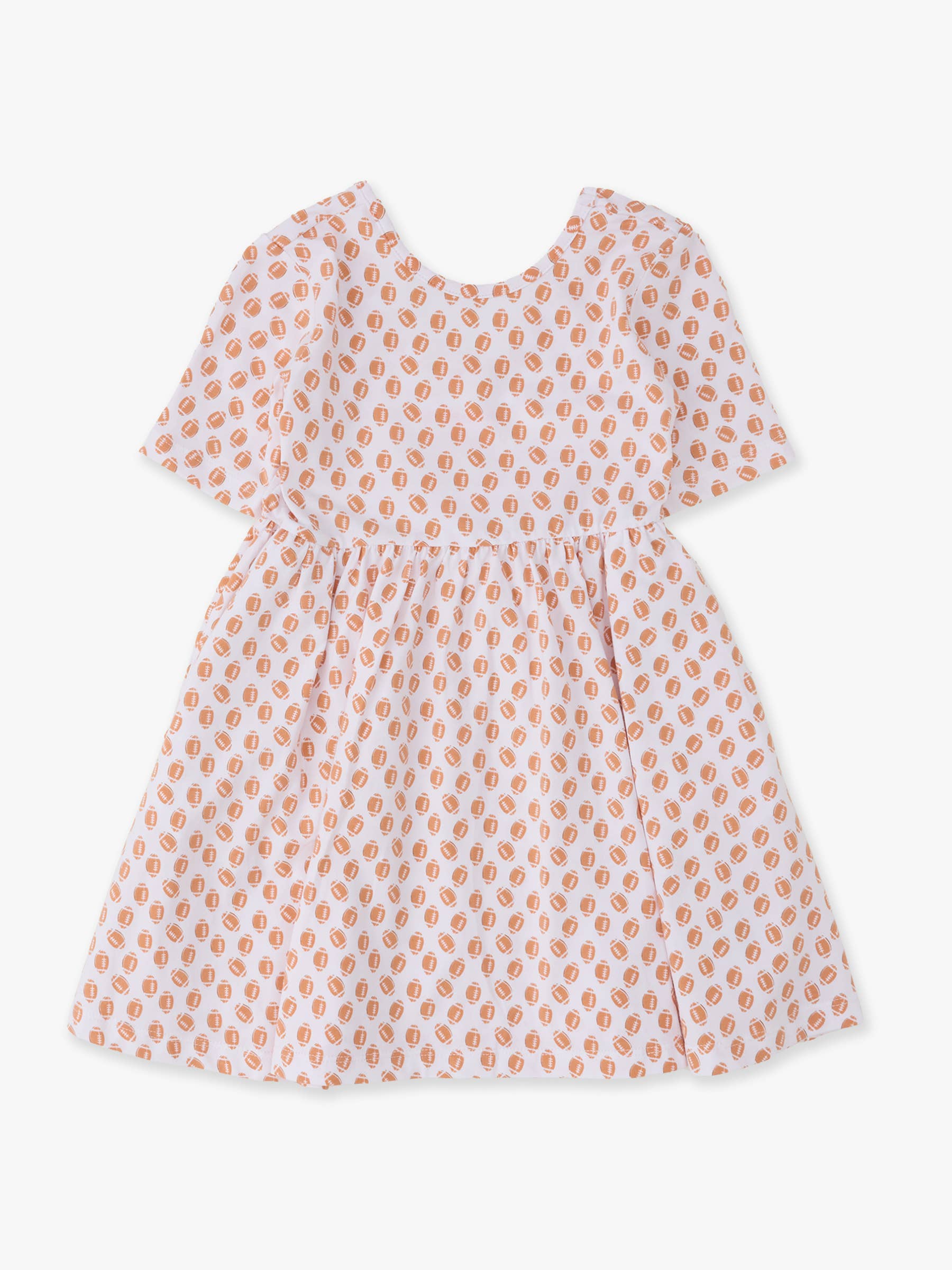 A short-sleeve baby dress with a white base and a repeating peach-orange paisley pattern, shown flat against a light gray background.