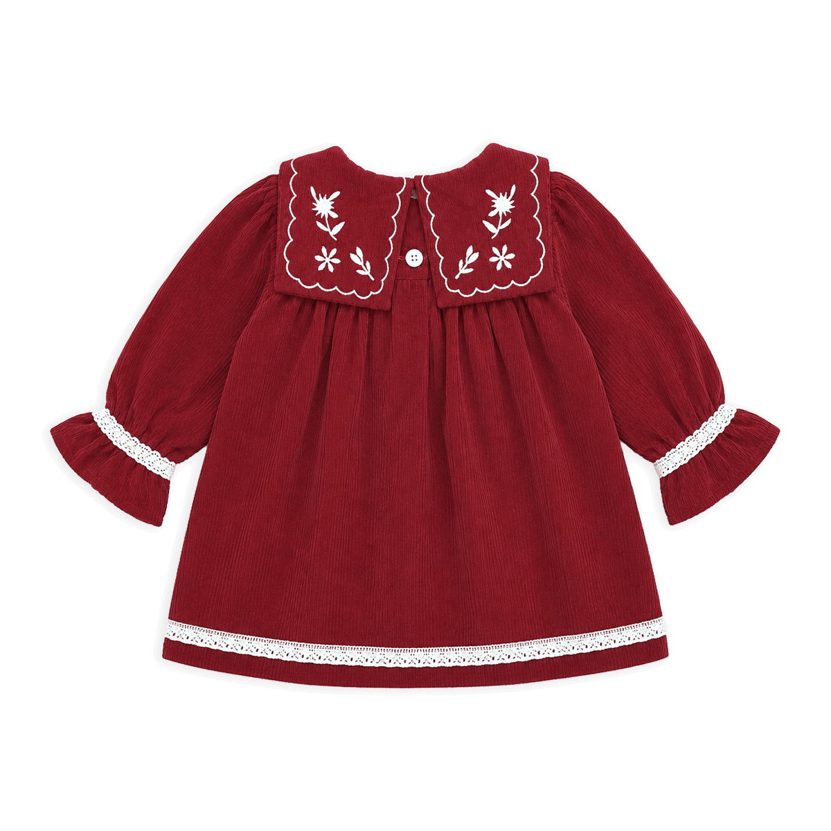 A red long-sleeve baby dress with white embroidered floral details on the collar, white lace trim on the cuffs and hem, and a small white button at the back neckline, shown against a solid black background.