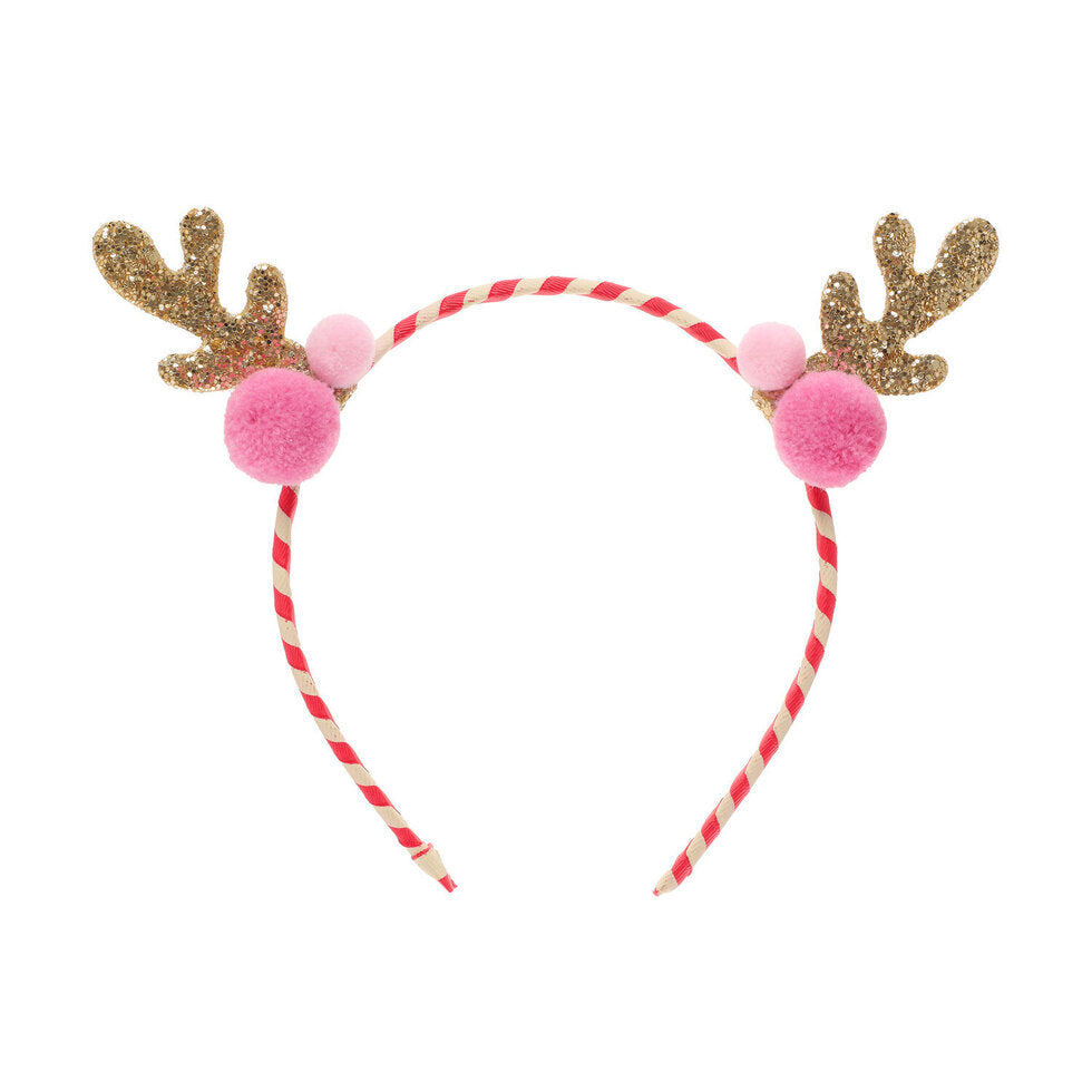 Headband with gold glitter reindeer antlers and pink pom-poms on a white background