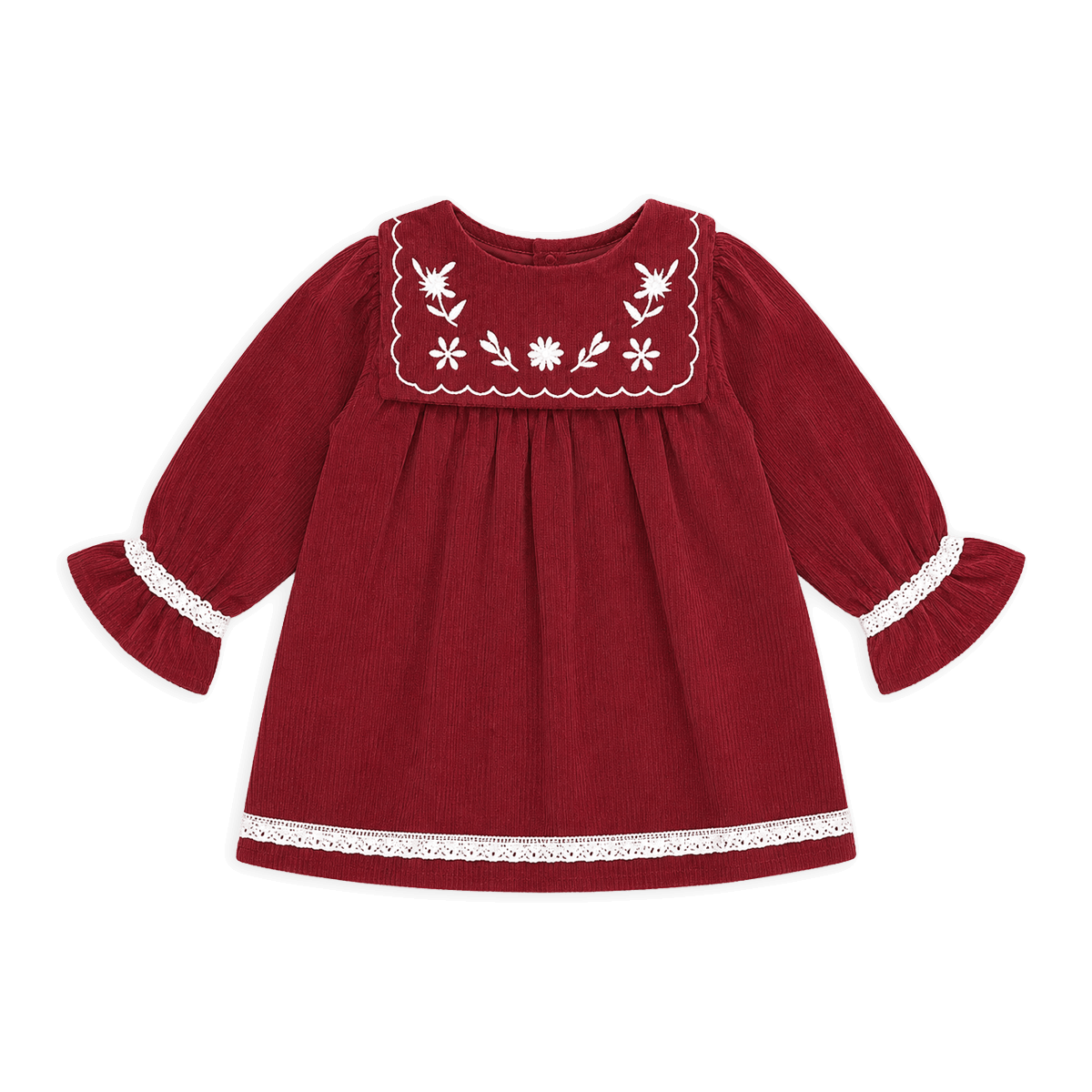 Red dress with white embroidery on a black background