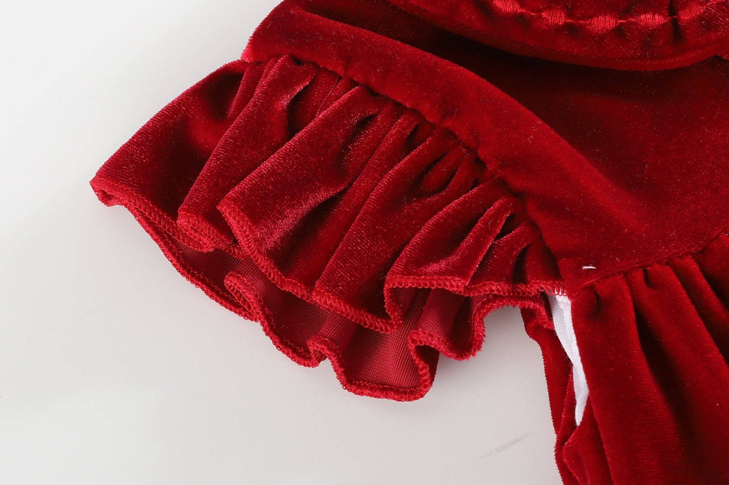 Red velvet fabric with ruffled edge on a white background